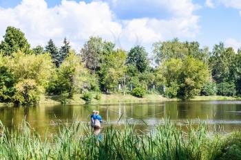 view of Zhabenka river near urban Large Garden Pond in Timiryazevskiy park of Moscow city in summer