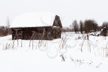 abandoned shed in old russian village in overcast winter day in little village in Smolensk region of Russia