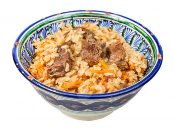 side view of prepared plov (central asian dish from rice with meat and vegetable) in traditional ceramic bowl isolated on white background