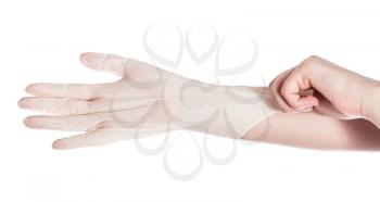 top view of female hand wears latex glove on another hand isolated on white background