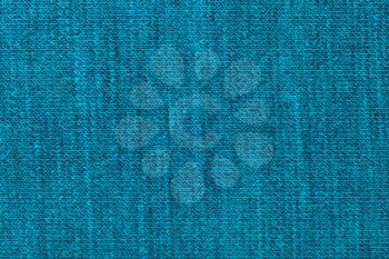 textile background - weaving of threads in wool jersey knitted fabric close up