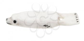 traditional bone carving of the peoples of the north of Russia (Chukchi) - seal figurine carved from walrus tusk isolated on white background