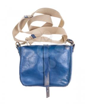 back side of handmade blue leather handbag with textile strap isolated on white background