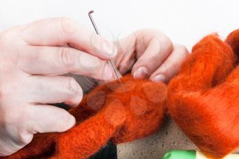 master class of repairing fleece glove using Needle felting process - craftsman mending felted cloth with felting needle