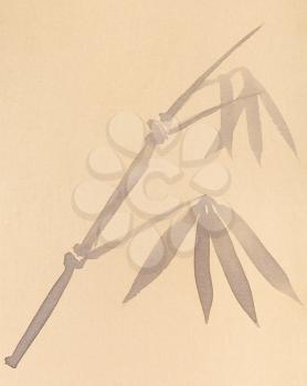 training drawing in sumi-e (suibokuga) style - twig of bamboo handpainted by black watercolors on yellow paper