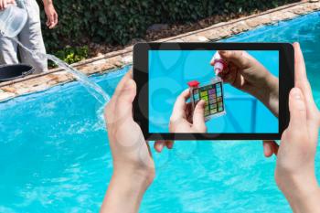 travel concept - tourist photographs of addition of a chemical to pH meter for measure the acidity of water in a outdoor swimming pool on smartphone