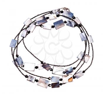 top view of handcrafted necklace from black glass beads and polished pieces of mother-of-pearl isolated on white background