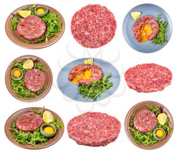 set of cooked Steak tartare (raw minced beef meat and raw yolk in bowl on fresh greens) isolated on white background
