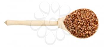 top view of raw red rice in wood spoon isolated on white background