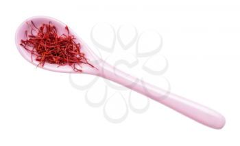 top view of crocus saffron threads in ceramic spoon isolated on white background