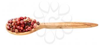 wooden spoon with pink peppercorns (Baie rose) isolated on white background