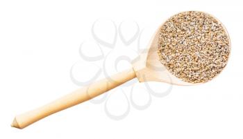 top view of crushed rye groats in wood spoon isolated on white background