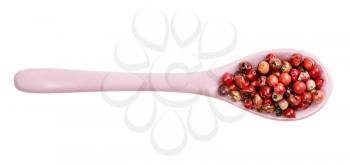 top view of ceramic spoon with pink peppercorns (Baie rose) isolated on white background
