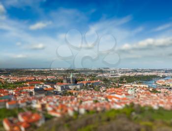 Aerial view of Hradchany part of Prague - the Saint Vitus St. Vitt's Cathedral and Prague Castle, view from Petrin Observation Tower with tilt shift toy effect shallow depth of field. Prague, Czech Re