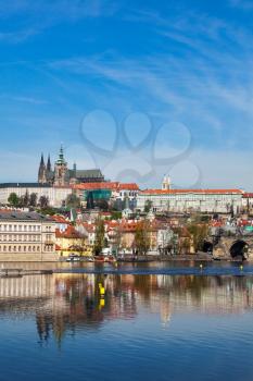 View of Charles bridge over Vltava river and Gradchany Prague Castle and St. Vitus Cathedral