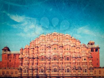 Vintage retro hipster style travel image of Famouse Rajasthan landmark - Hawa Mahal palace (Palace of the Winds), Jaipur, Rajasthan with grunge texture overlaid
