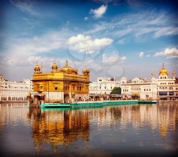 Vintage retro effect filtered hipster style travel image of Sikh gurdwara Golden Temple (Harmandir Sahib). Amritsar, Punjab, India