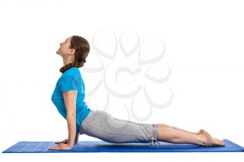Yoga - young beautiful woman yoga instructor doing  Upward Facing Dog Pose (Back Bend) (Urdhva Mukha Svanasana) asana exercise isolated on white background