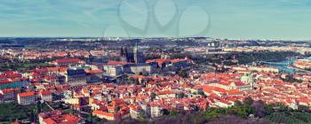 Vintage retro hipster style travel image of aerial panorama of Hradchany the Saint Vitus St. Vitt's Cathedral and Prague Castle. Prague, Czech Republic