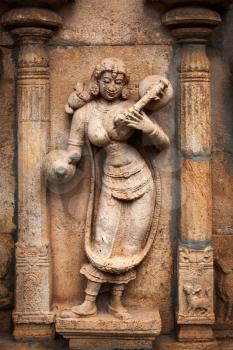 Musician playing veena.Bas reliefes in Hindu temple. Sri Ranganathaswamy Temple. Tiruchirappalli (Trichy), Tamil Nadu, India