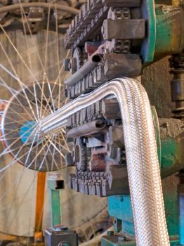 Flexible metal hose production line.Braiding machine taken closeup.