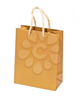 Empty golden gift bag isolated on a white background.