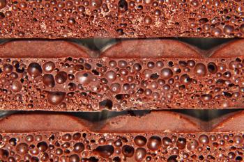 Porous chocolate taken closeup as background.