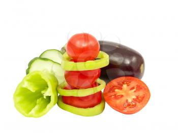 Fresh vegetables and tomatoes isolated on a white background.