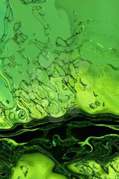 Stylized green liquid texture as abstract background.Digitally generated image.