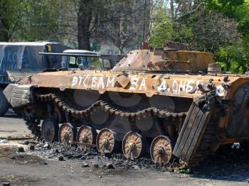 MARIUPOL,UKRAINE-MAY 09,2014: Destroyed armored car on the street of Mariupol after armed conflict.