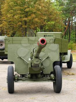 MARIUPOL, UKRAINE-SEPT 9:Soviet 76mm cannon gan ZiS3 and army truck ZiS5,(Ural) taken closeup,historical reenactment of WWII, September 9, 2013 in Mariupol,Ukraine