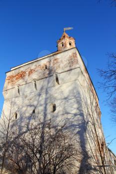 Old castle tower against of blue sky.