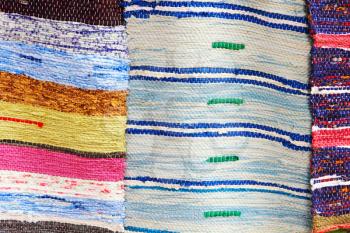 Colorful handmade rugs taken closeup as abstract background.