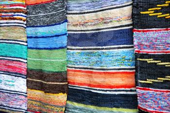 Multicolored handmade rugs as abstract background.