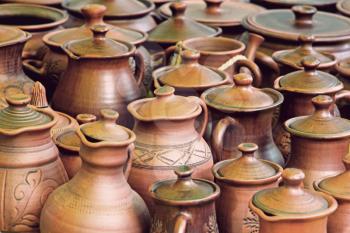 Lot of ceramics pots for sale taken closeup.Toned image.