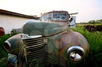 Abandoned vintage car in Saskatchewan Canada field