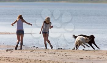 Girls and Dogs at the Beach Saskatchewan Canada Diefenbaker Lake