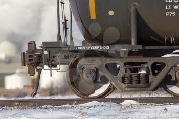 Close up rail car wheels tanker metal moving