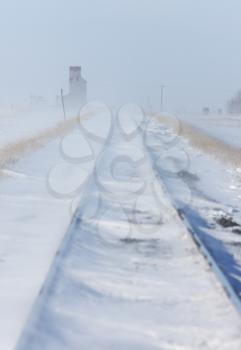 Train Tracks and Grain Elevator in Blizzard Saskatchewan 