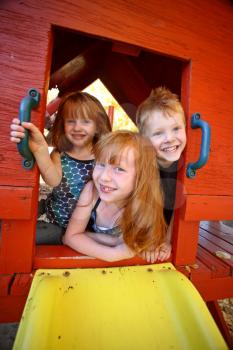 Children enjoying playhouse