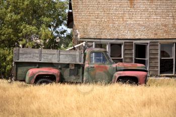 Abandoned truck and farm house in scenic Saskatchewan