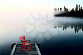 Northern Saskatchewan Lake Red Chair on Dock