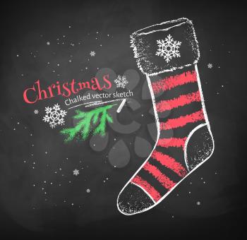 Color red and white chalk drawing of striped Christmas sock on black chalkboard background.