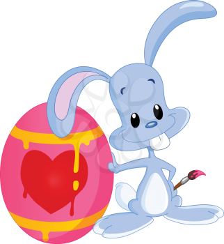 Cute bunny lying on his painted Easter egg holding a paintbrush