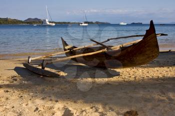 madagascar nosy be rock stone branch yacht boat palm lagoon and coastline