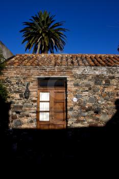 brown wood old door  in the centre of colonia del sacramento uruguay
