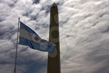 waving flag and tower a la republica in the center of buenos aires argentina