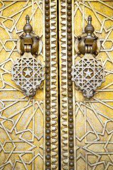 metal brown    morocco in    africa the old wood  facade home and rusty safe padlock 