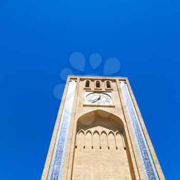 in iran old yazd city and the antique brick   clock  tower near the sky