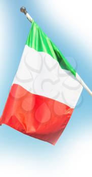 italian waving flag in the free sky concept of national symbol